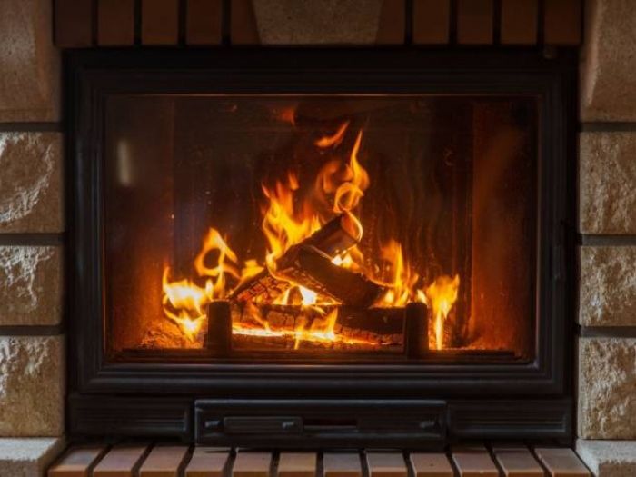 A lit household wood burning fire