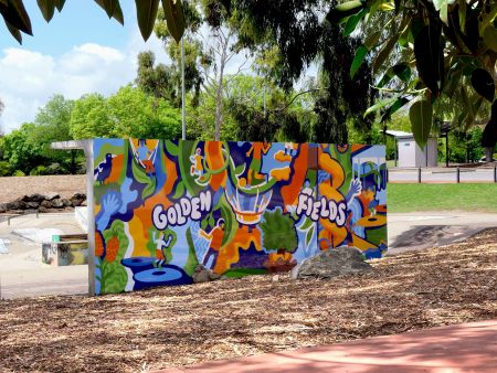 Bright colourful mural on toilet block in park