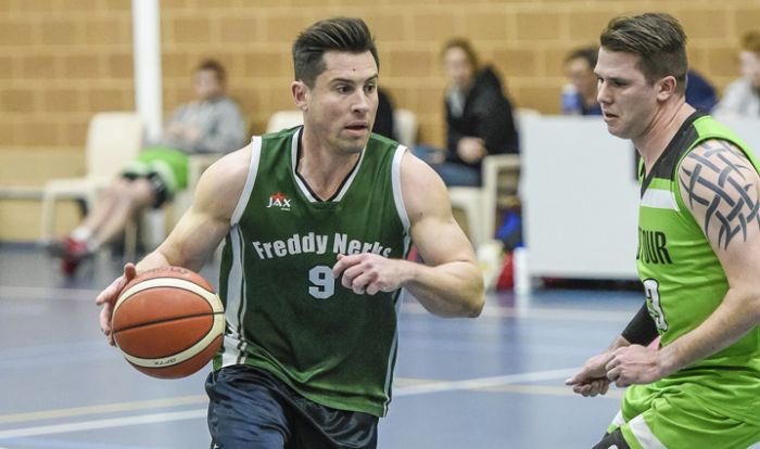 Men playing basketball