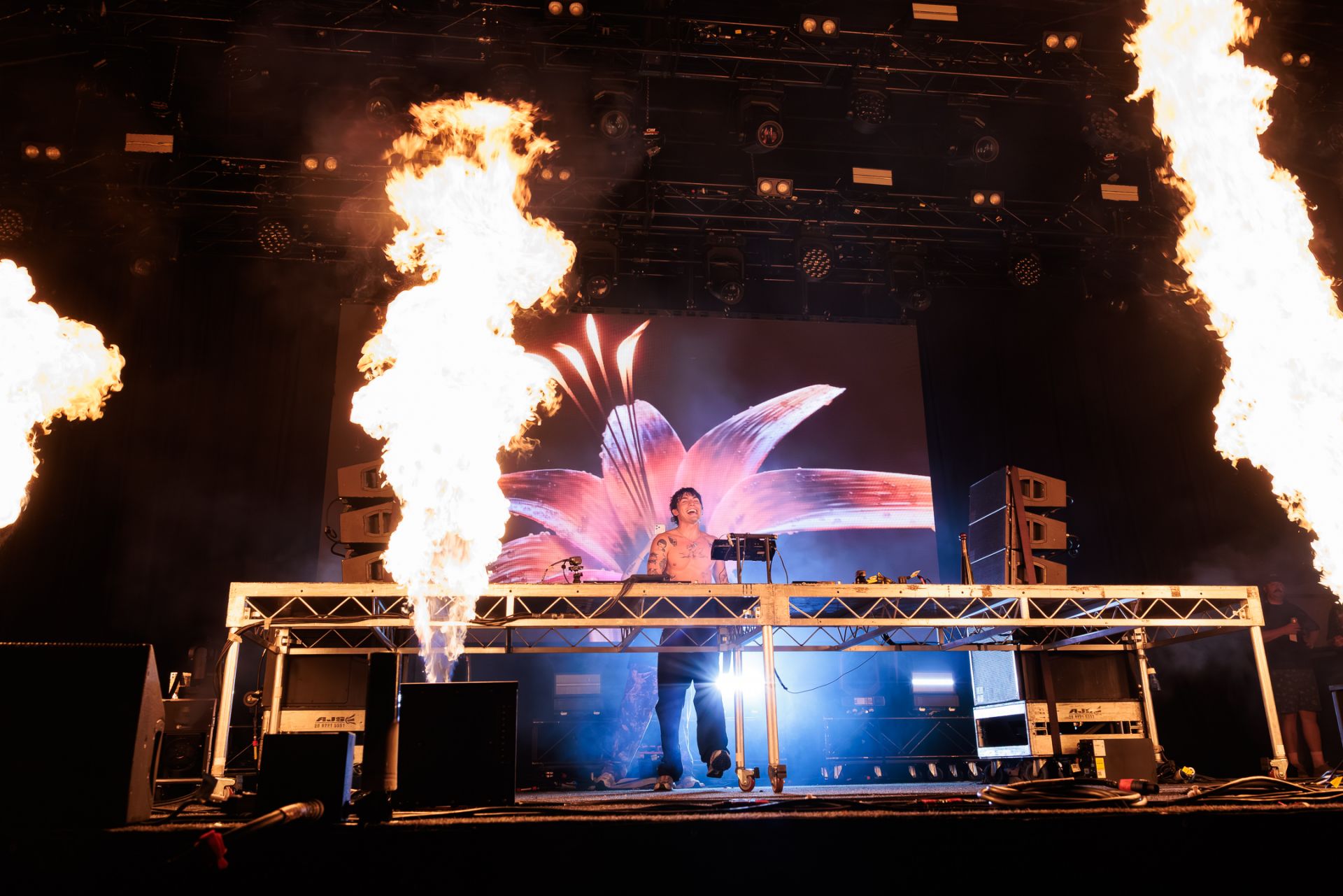 Music DJ on stage with fire display