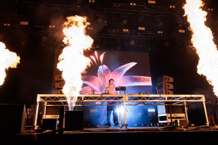 Music DJ on stage with fire display