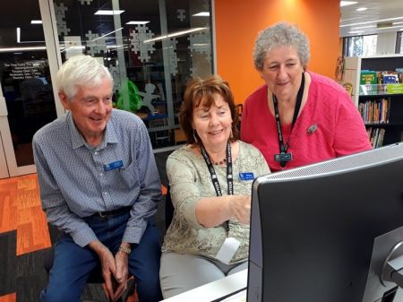 Volunteer with library customer