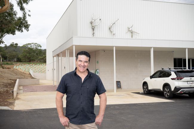 Artist Claude Portelli and the three gymnast sculptures