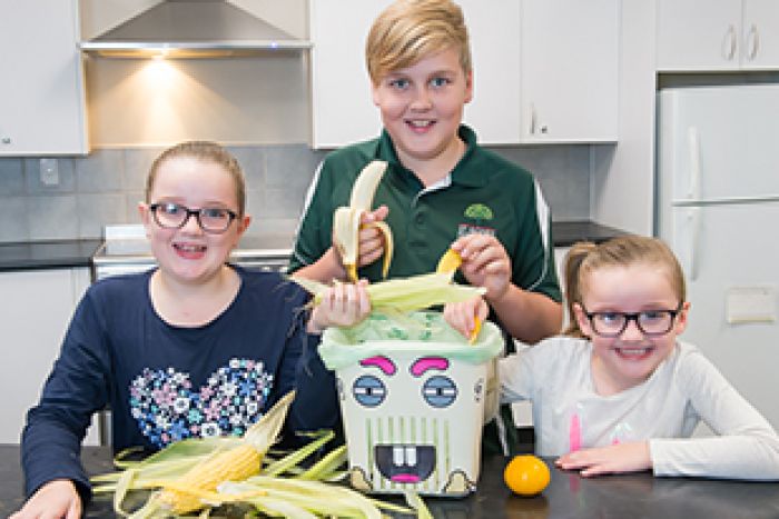 Children recycling food waste