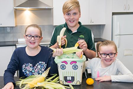 Children recycling food waste