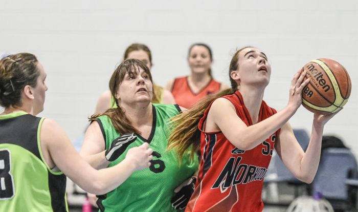 Lady playing basketball