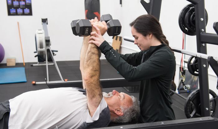 Older person exercising with weights