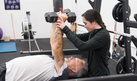 Older person exercising with weights