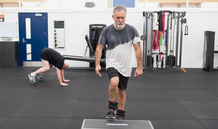 Man exercising indoors