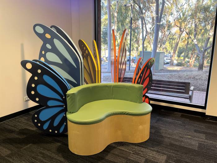 Large butterfly wings decorating the back of a soft chair