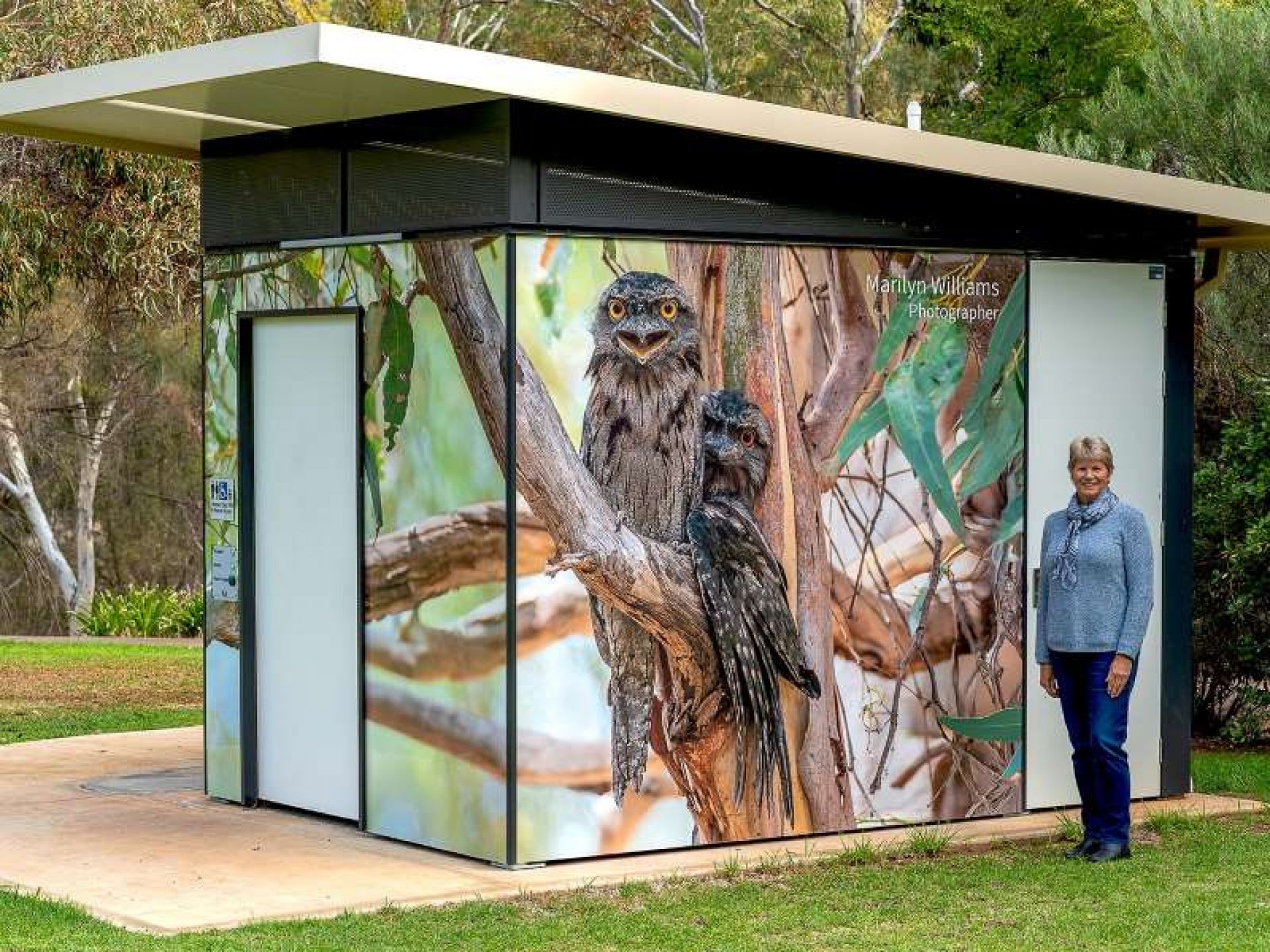 Toilet block wrapped in a photo of birds