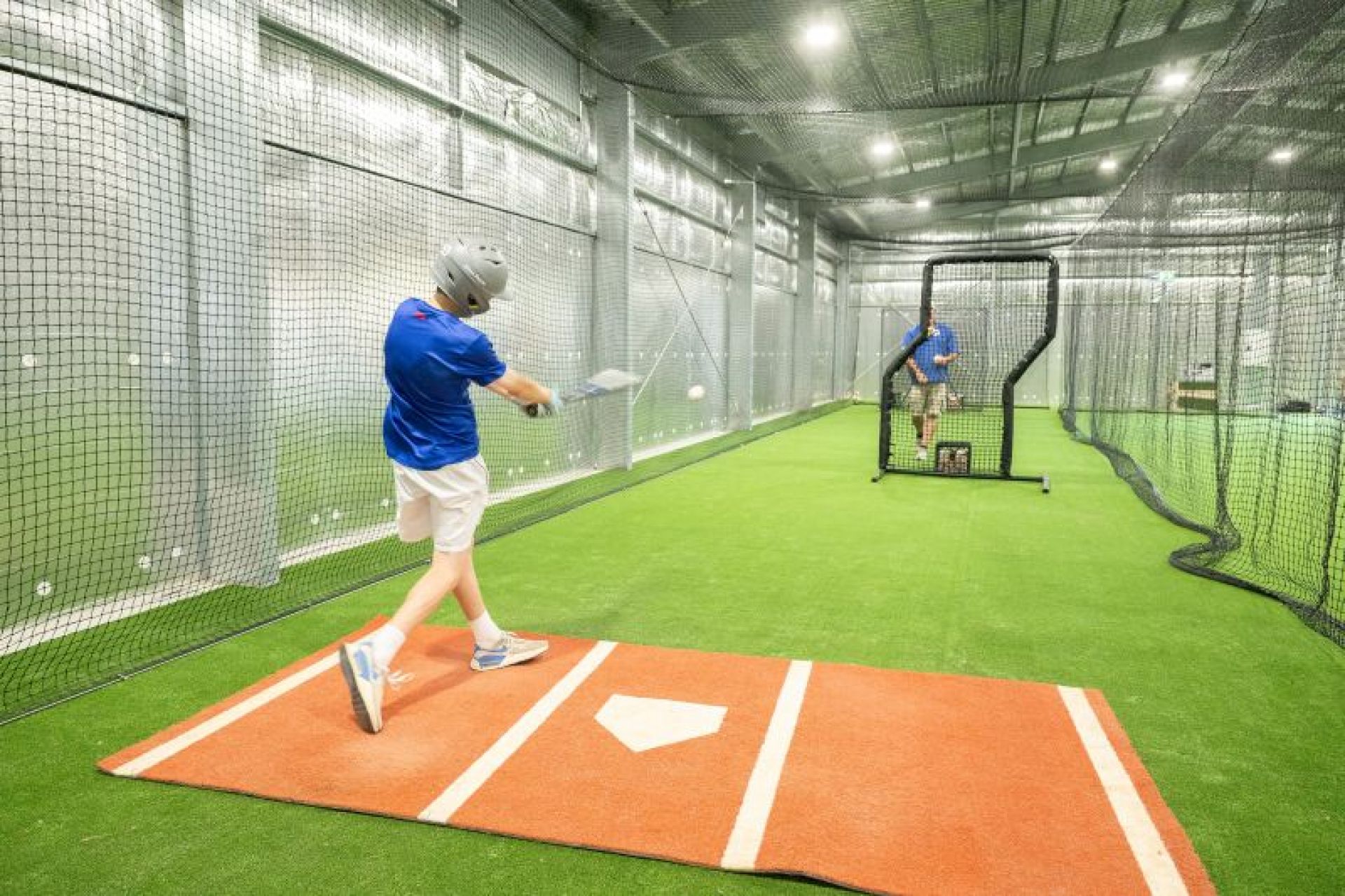 Young person practising baseball batting