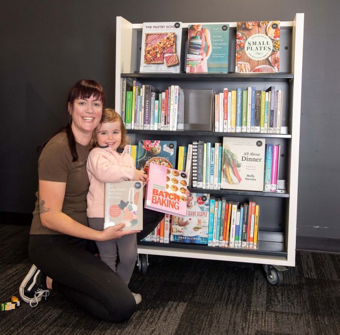 Customers at library shelves