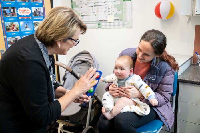 Immunisation nurse with patient