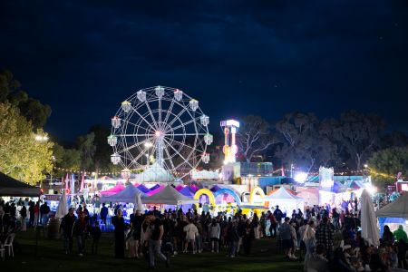 Civic Park night event with rides and crowd