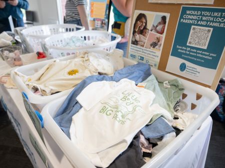 Baskets of baby clothes