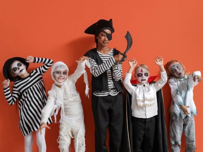 Several children dressed up in halloween outfits