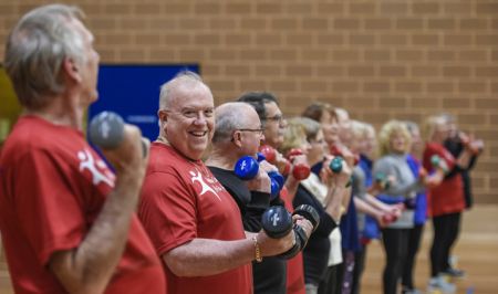 Men and women exercising together