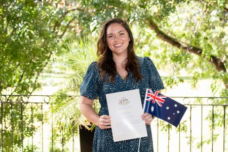 Person holding certificate and Aussie flag