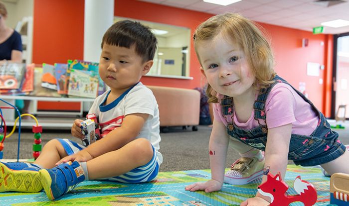 Toddlers playing inside