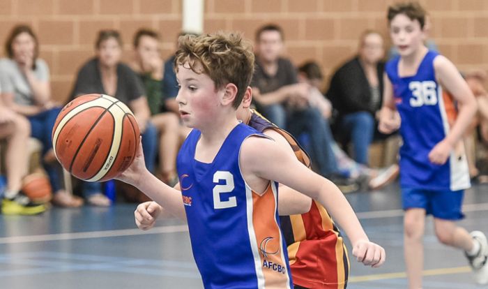 Young boy playing basketball
