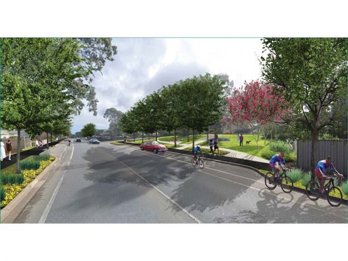 Main road with trees and bicycle tracks lining each side