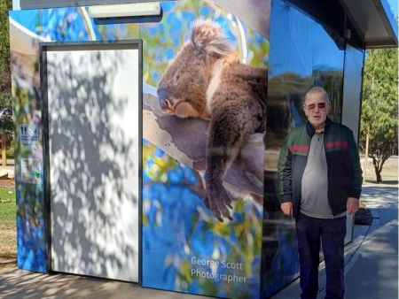 Toilet block wrapped in photo of koala