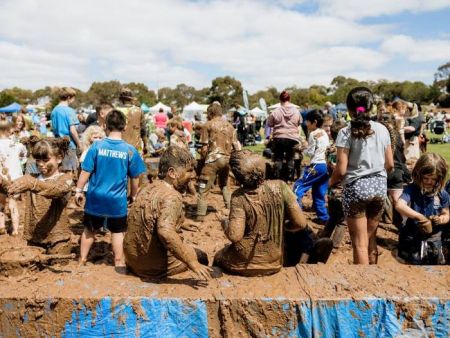 Children playing in a mud pit