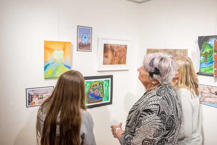 Patrons looking at exhibition pieces